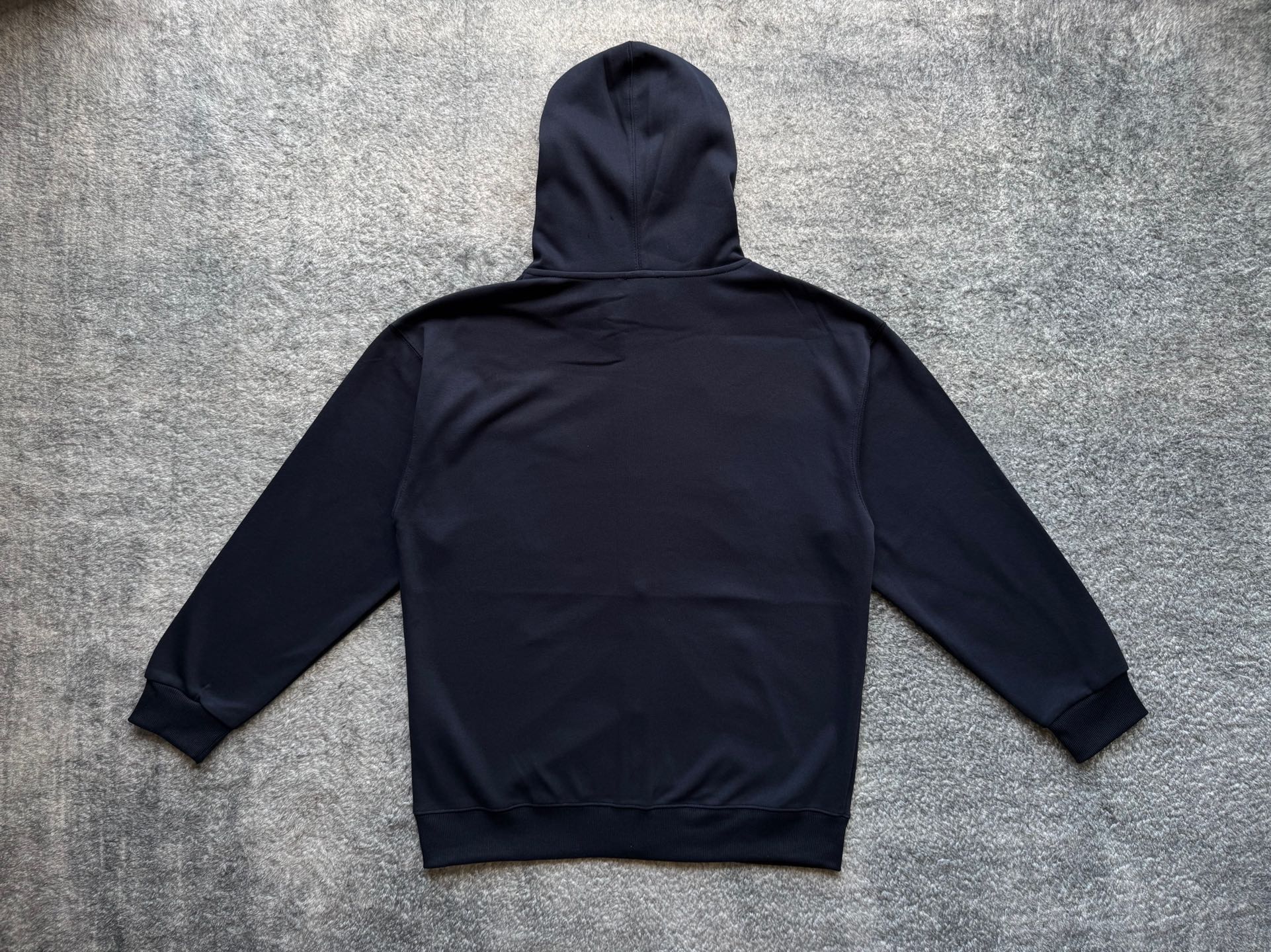 Dark pullover hoodie back view with hood and kangaroo pocket