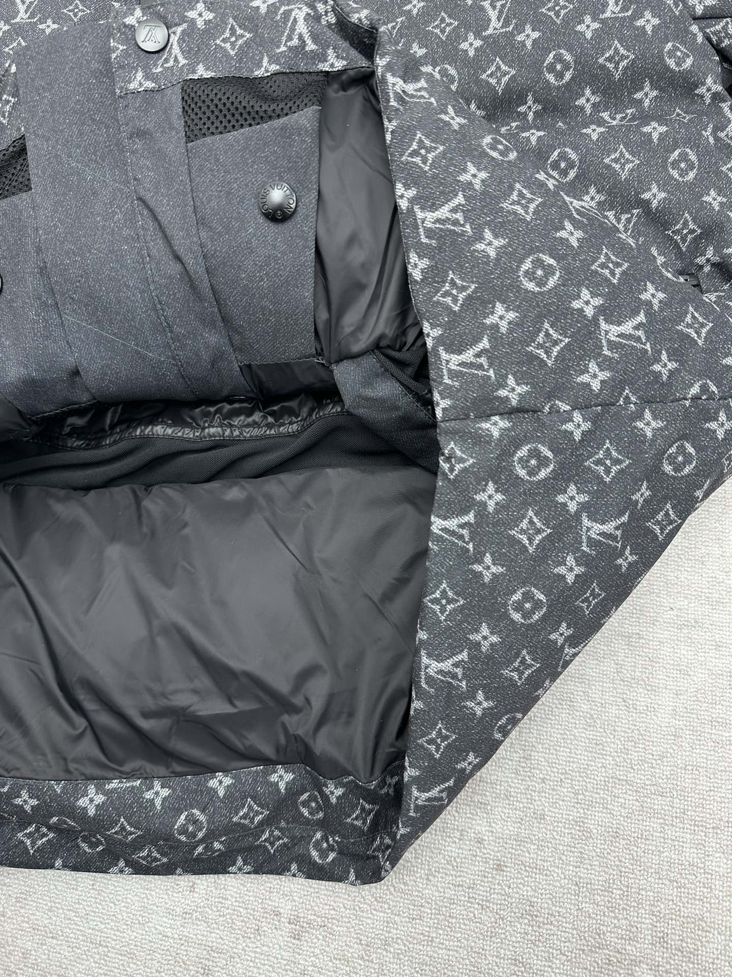 Louis Vuitton monogram puffer jacket interior lining with snap buttons, dark gray.