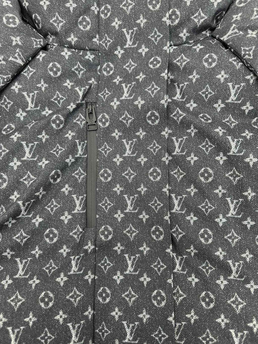 Louis Vuitton monogram puffer jacket front view with center zipper, dark gray.