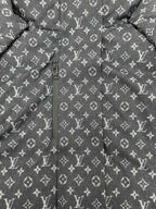 Louis Vuitton monogram puffer jacket front view with center zipper, dark gray.