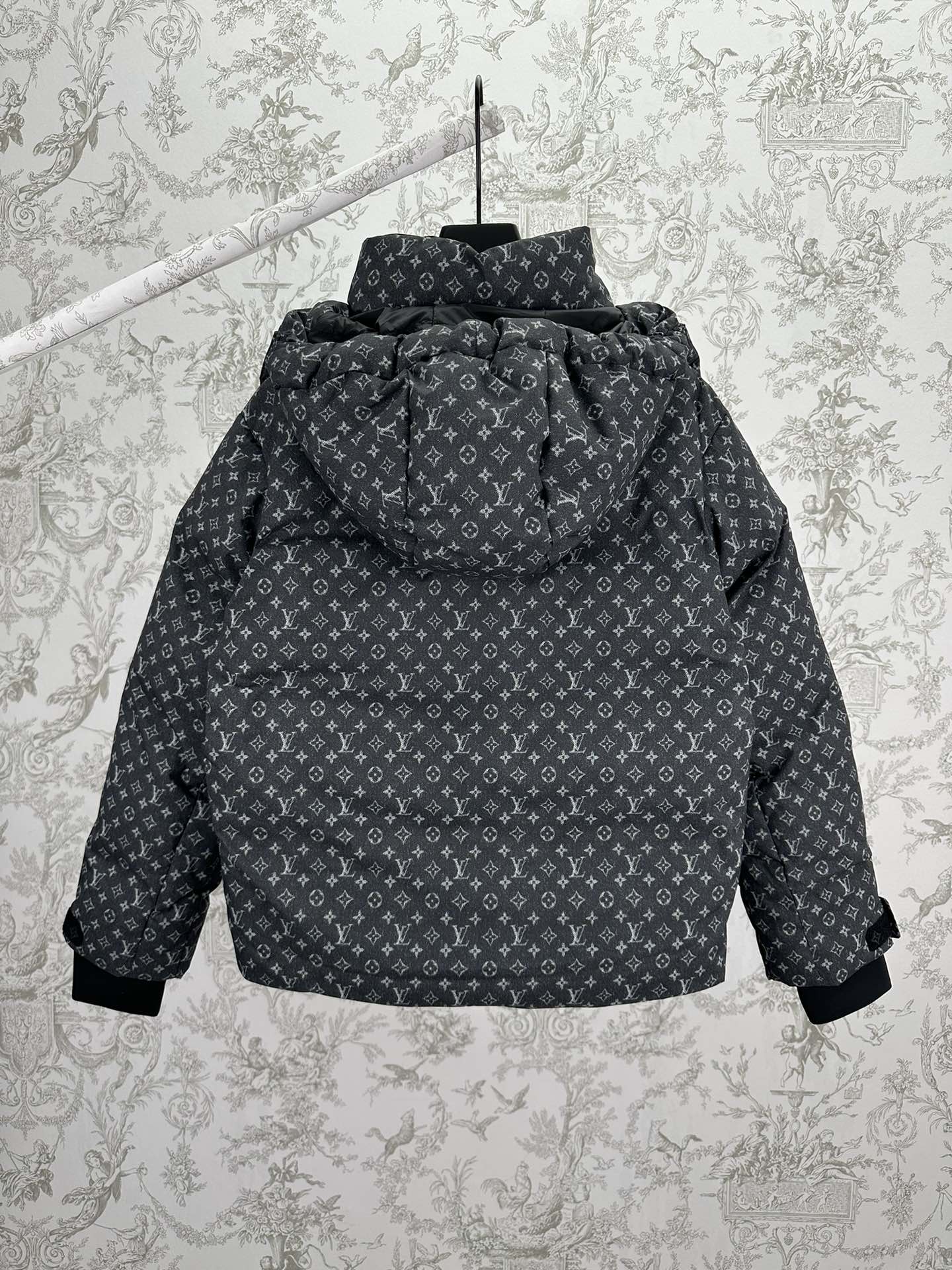 Louis Vuitton monogram puffer jacket with hood and zip front, dark gray.