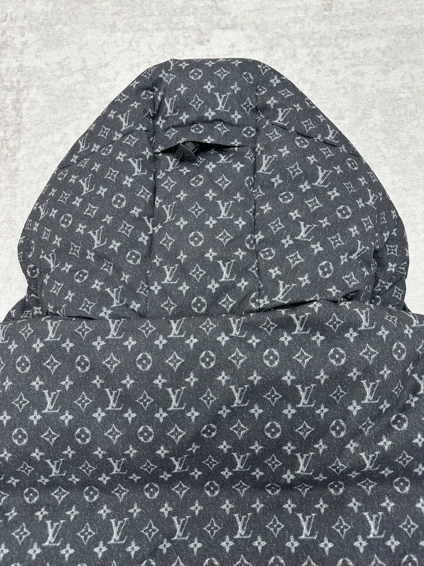 Louis Vuitton monogram hooded puffer jacket, quilted front panel, dark gray.