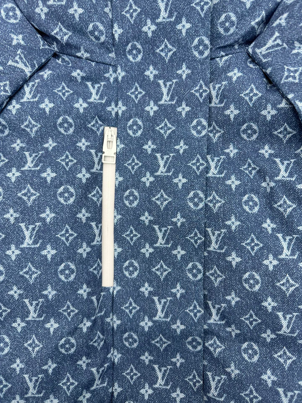 Blue Louis Vuitton monogram jacket with white zipper and hood pull tab
