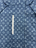 Blue Louis Vuitton monogram jacket with white zipper and hood pull tab