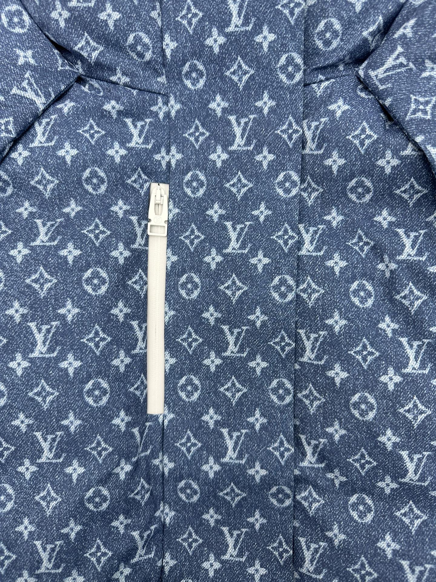 Blue Louis Vuitton monogram jacket with white zipper and hood pull tab