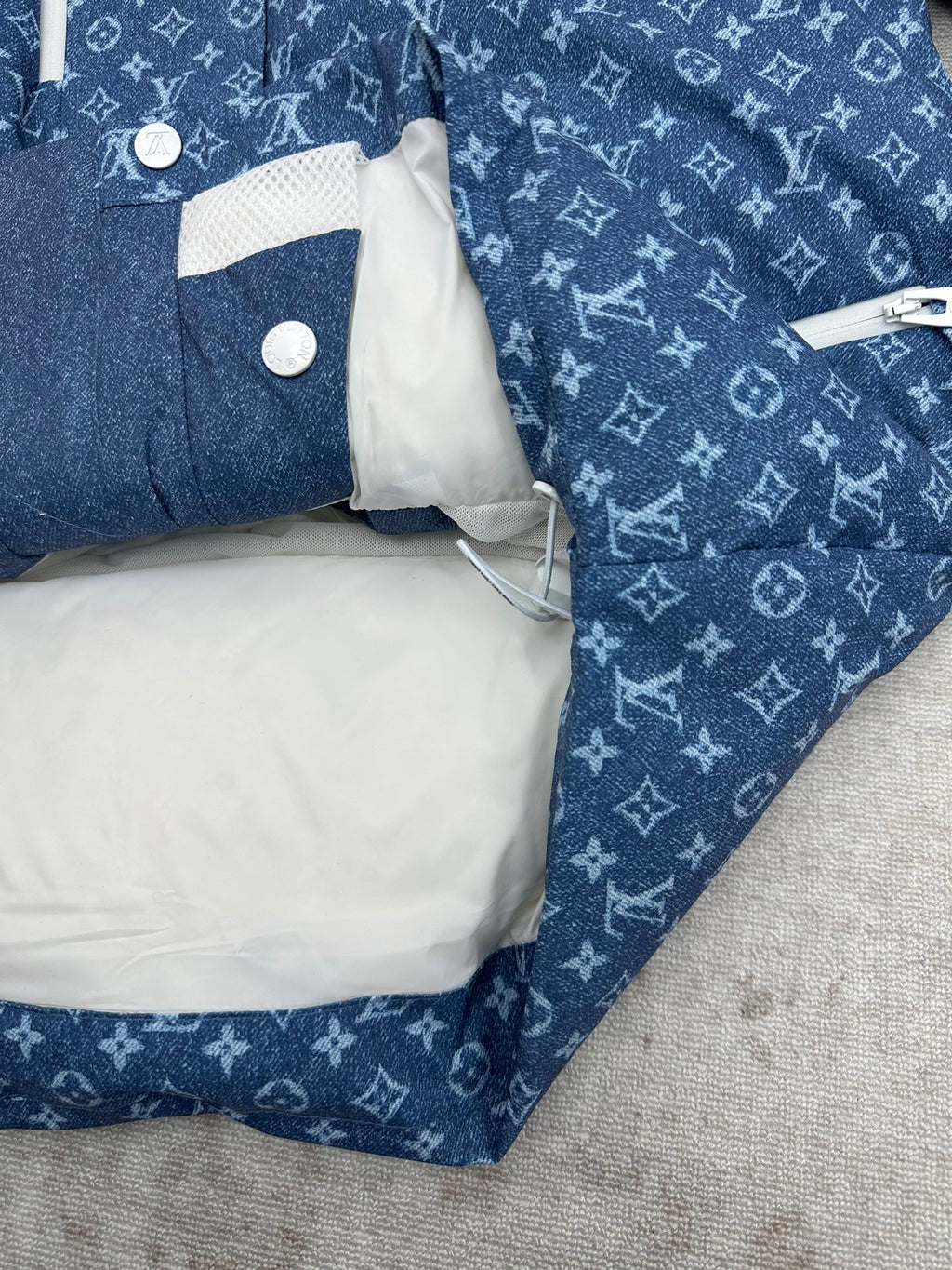 Blue Louis Vuitton monogram jacket with white-lined inner pocket flap and snap buttons