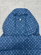 Blue hooded jacket with white Louis Vuitton monogram pattern and centered cord toggle