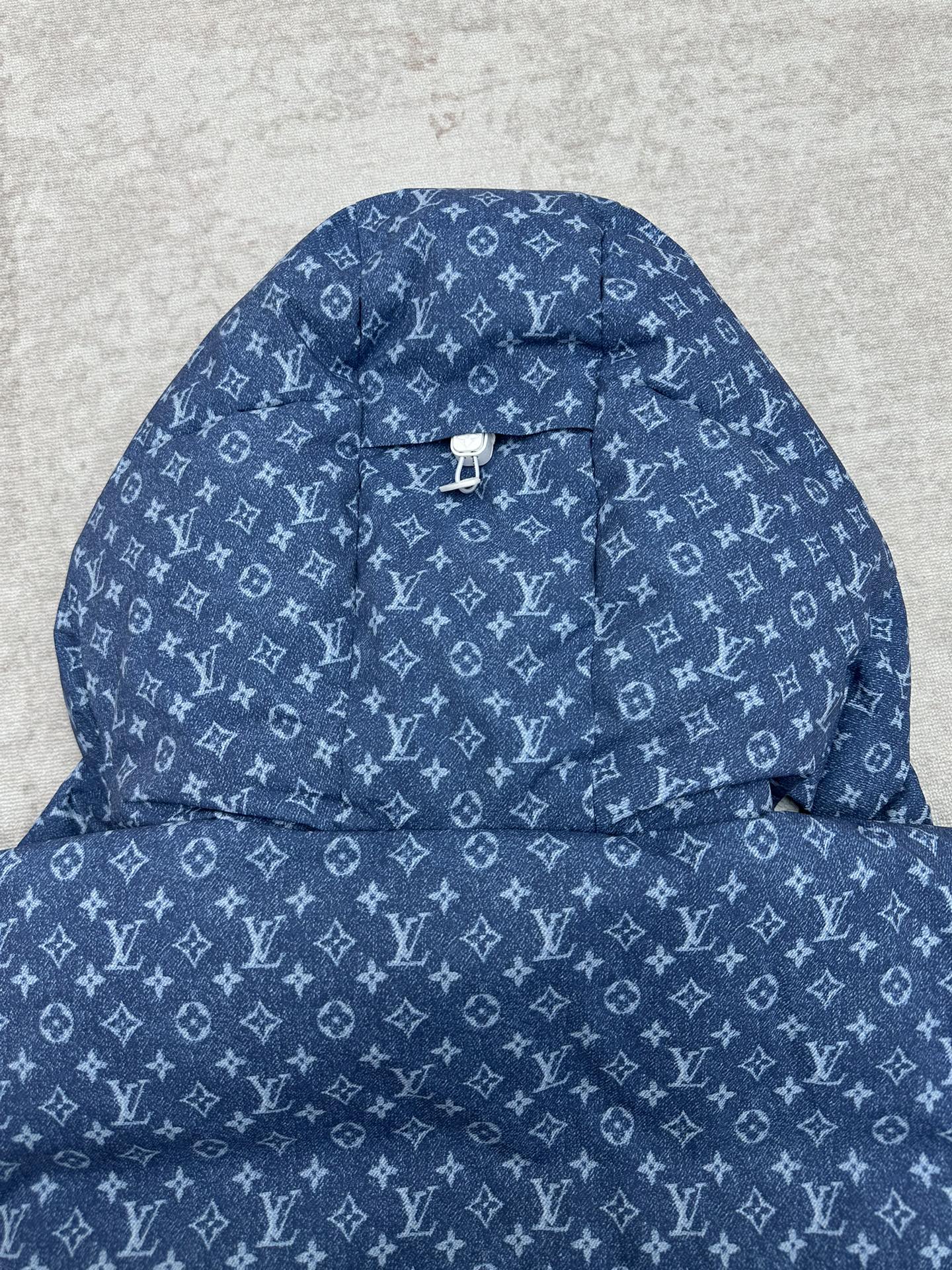 Blue hooded jacket with white Louis Vuitton monogram pattern and centered cord toggle