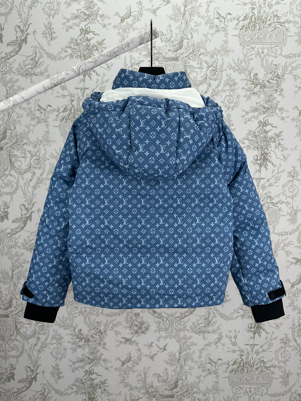 Blue hooded jacket with white Louis Vuitton monogram pattern, back view, black cuff hems