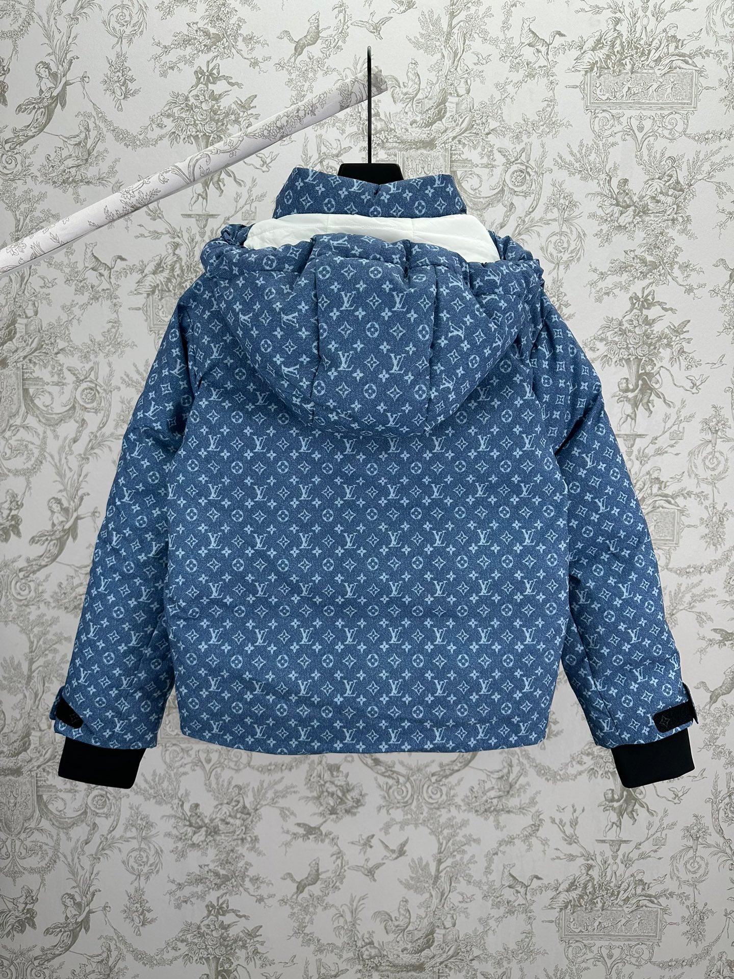 Blue hooded jacket with white Louis Vuitton monogram pattern, back view, black cuff hems