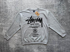 Stussy crewneck sweatshirt, light gray with white front city graphic