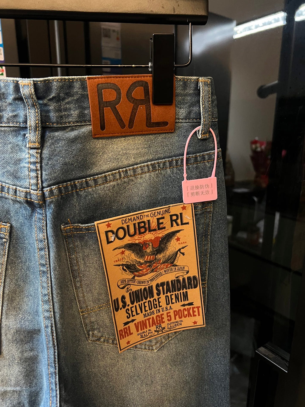 Light-wash denim jeans with RRL leather-look waistband patch and vintage-style tag