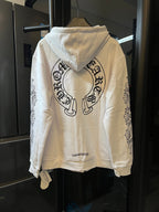 Light cream zip-up hoodie with hood and large back graphic print.