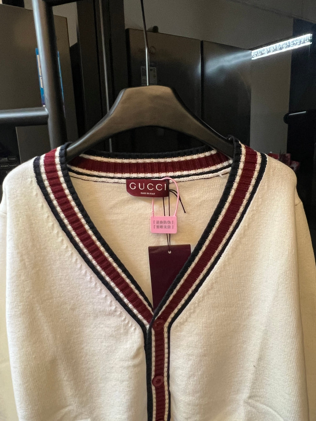 Cream Gucci knit cardigan V-neck with red and navy striped trim at neckline