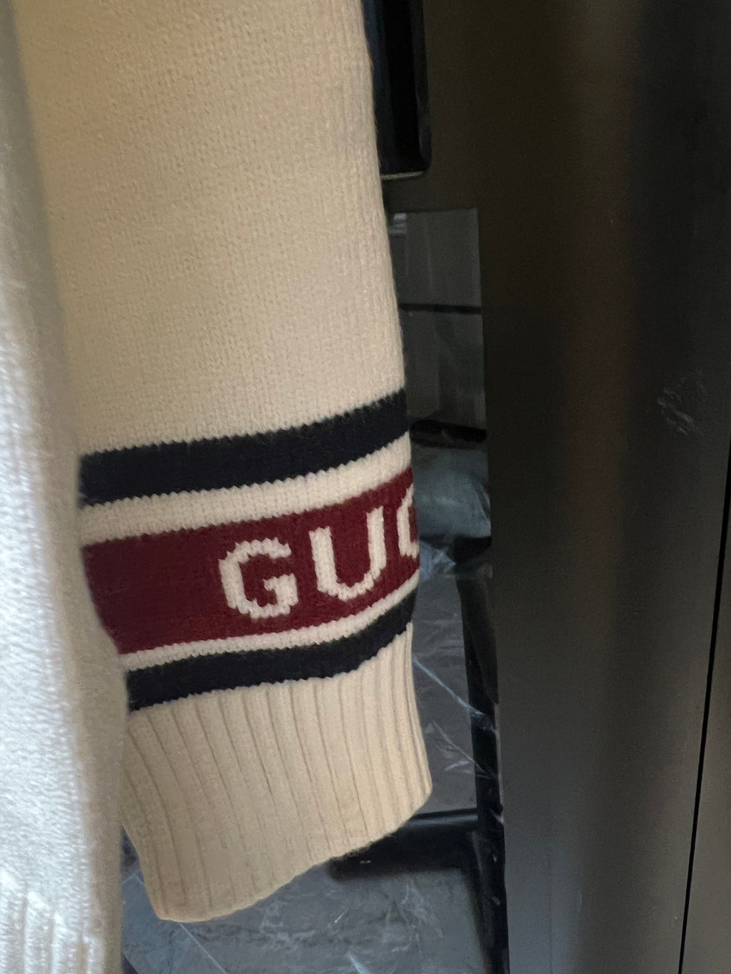 Cream Gucci knit cardigan sleeve cuff with striped logo band