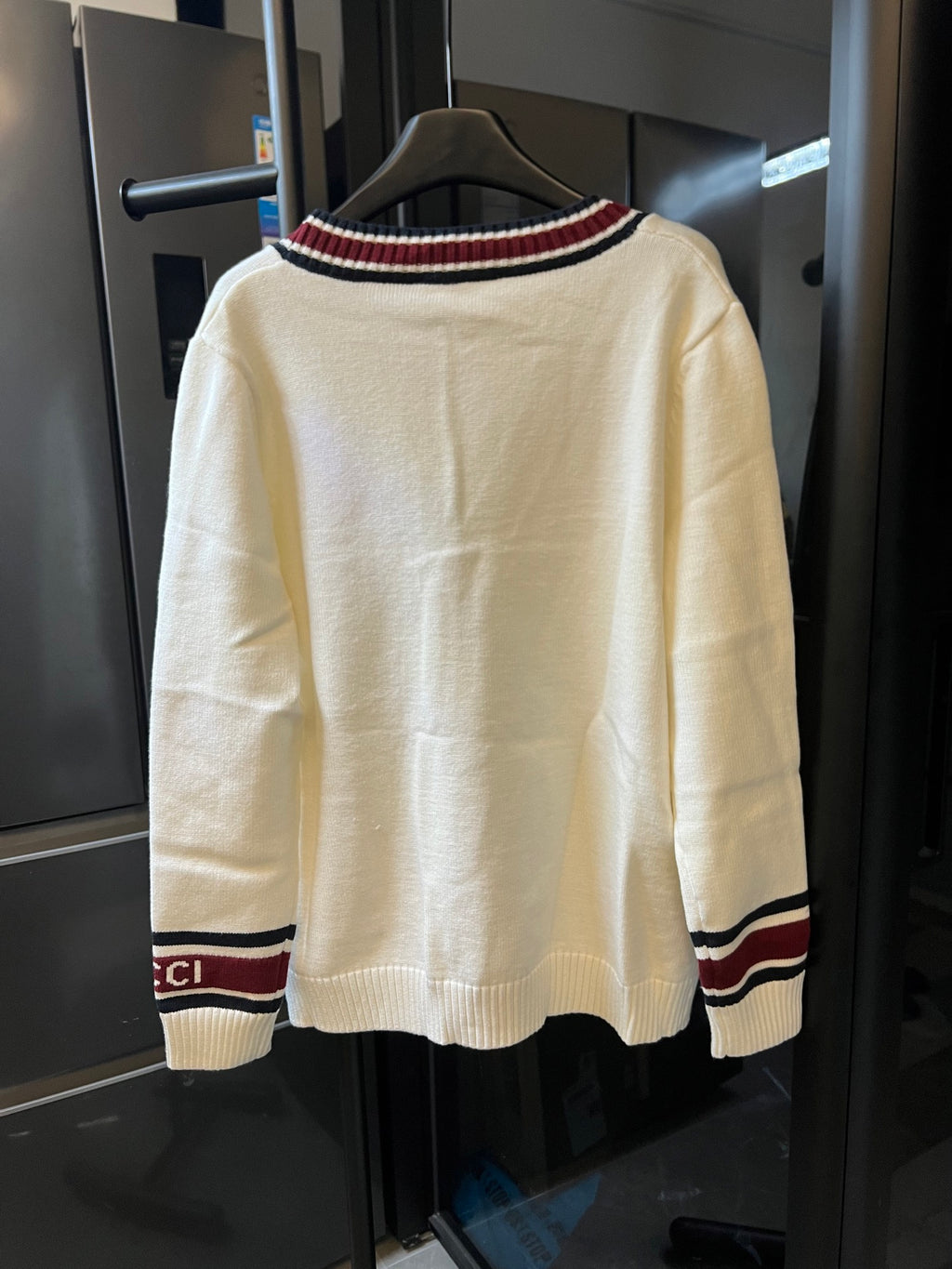 Cream Gucci knit cardigan back view with striped crew collar and ribbed hem cuffs