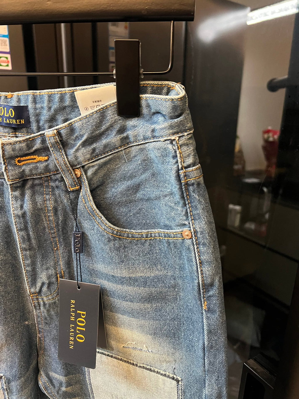 Light blue denim jeans with front pocket and hanging POLO hang tag