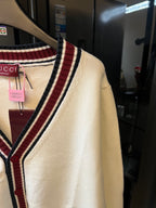 Cream Gucci knit cardigan with striped trim along side seam and shoulder