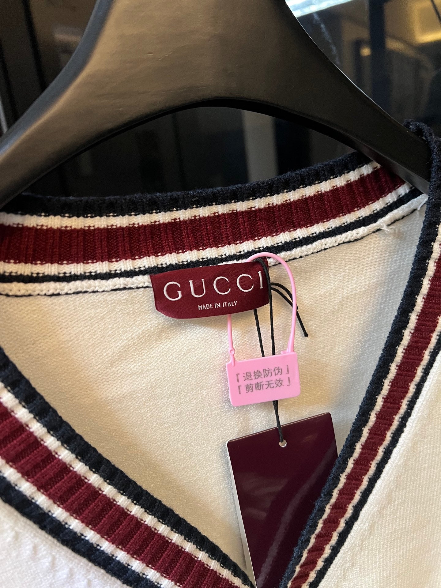 Gucci knit neckline with maroon, cream, and navy striped trim and hanging tags