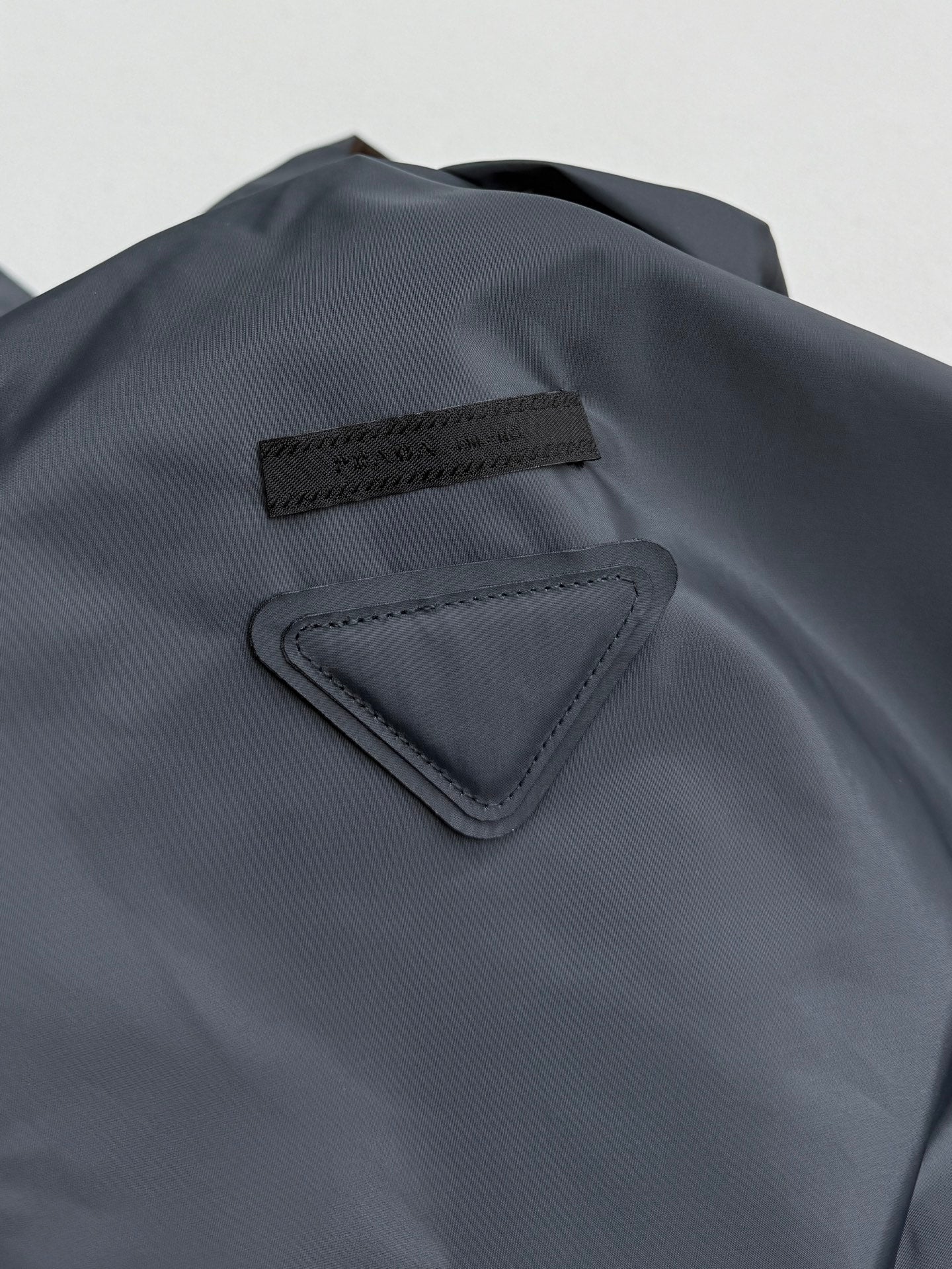 Prada hooded long jacket, blue-gray, chest logo patch and triangular trim