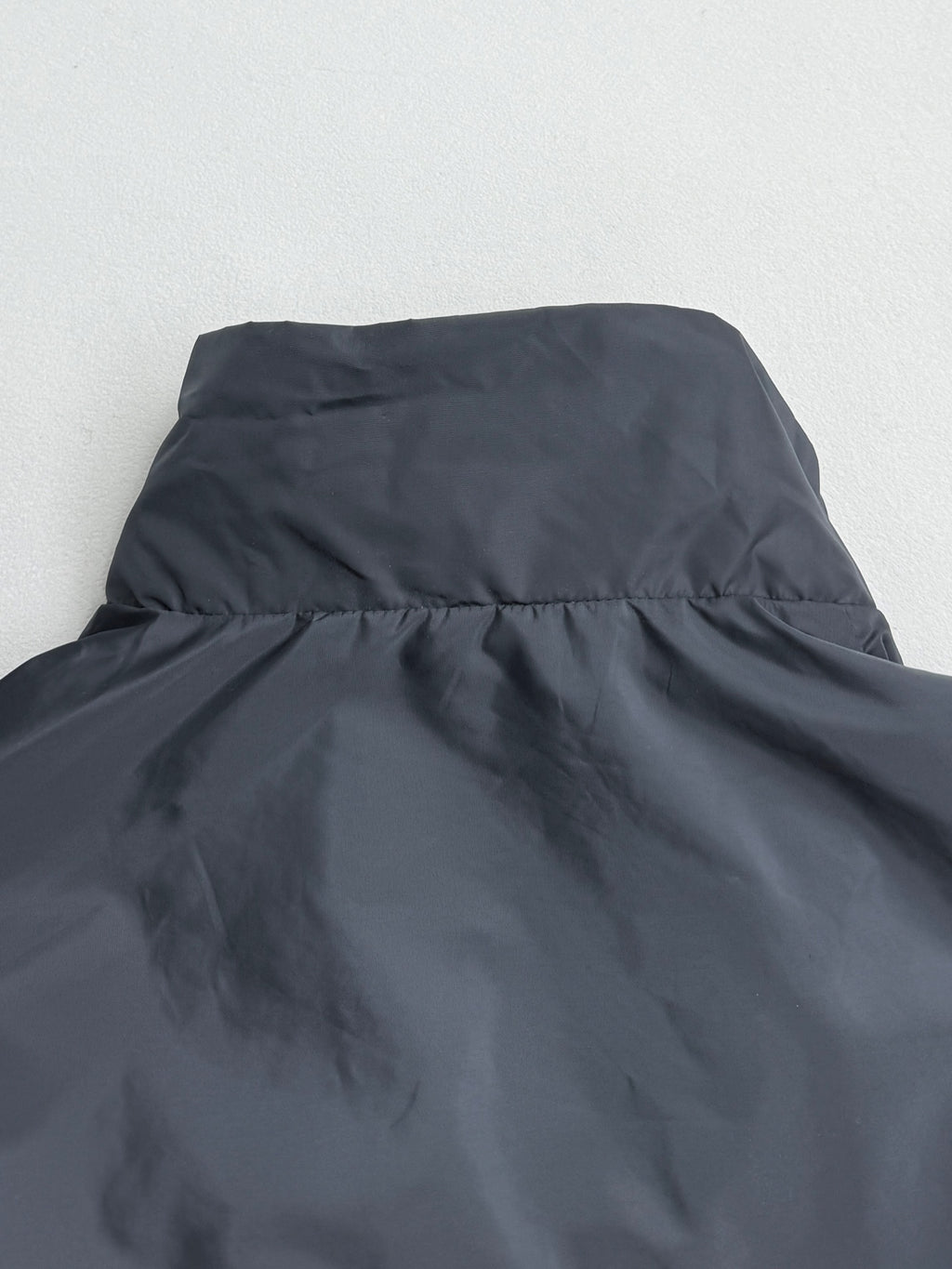 Prada hooded long jacket, blue-gray, collar and upper back seam close-up