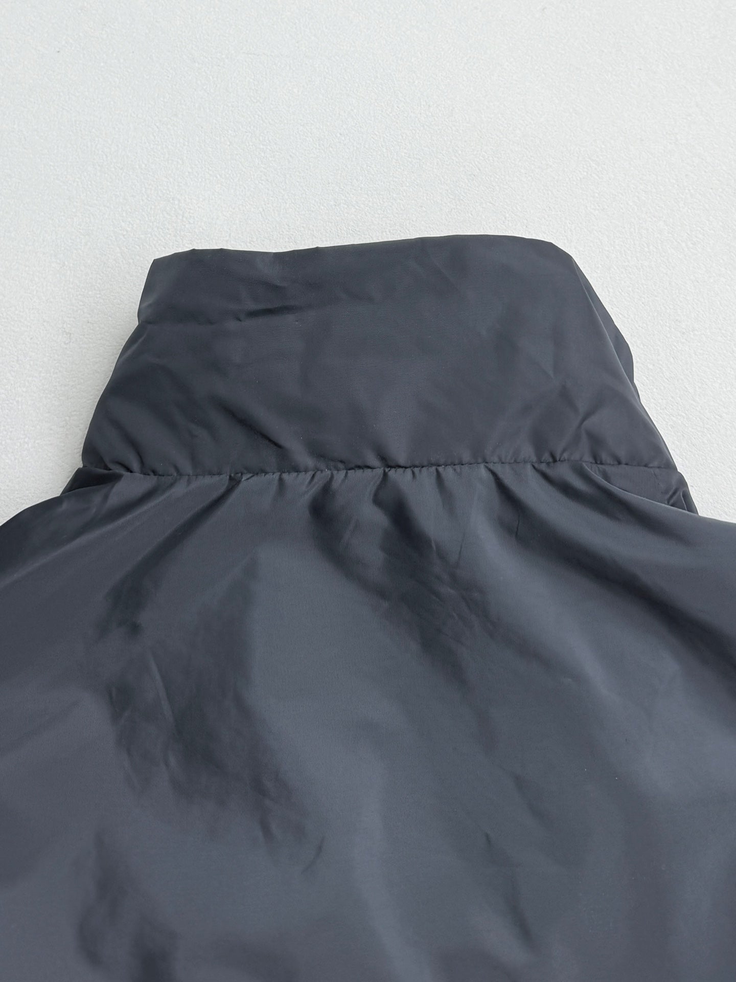 Prada hooded long jacket, blue-gray, collar and upper back seam close-up