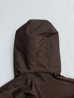 Long brown hooded jacket back view with stitched seams