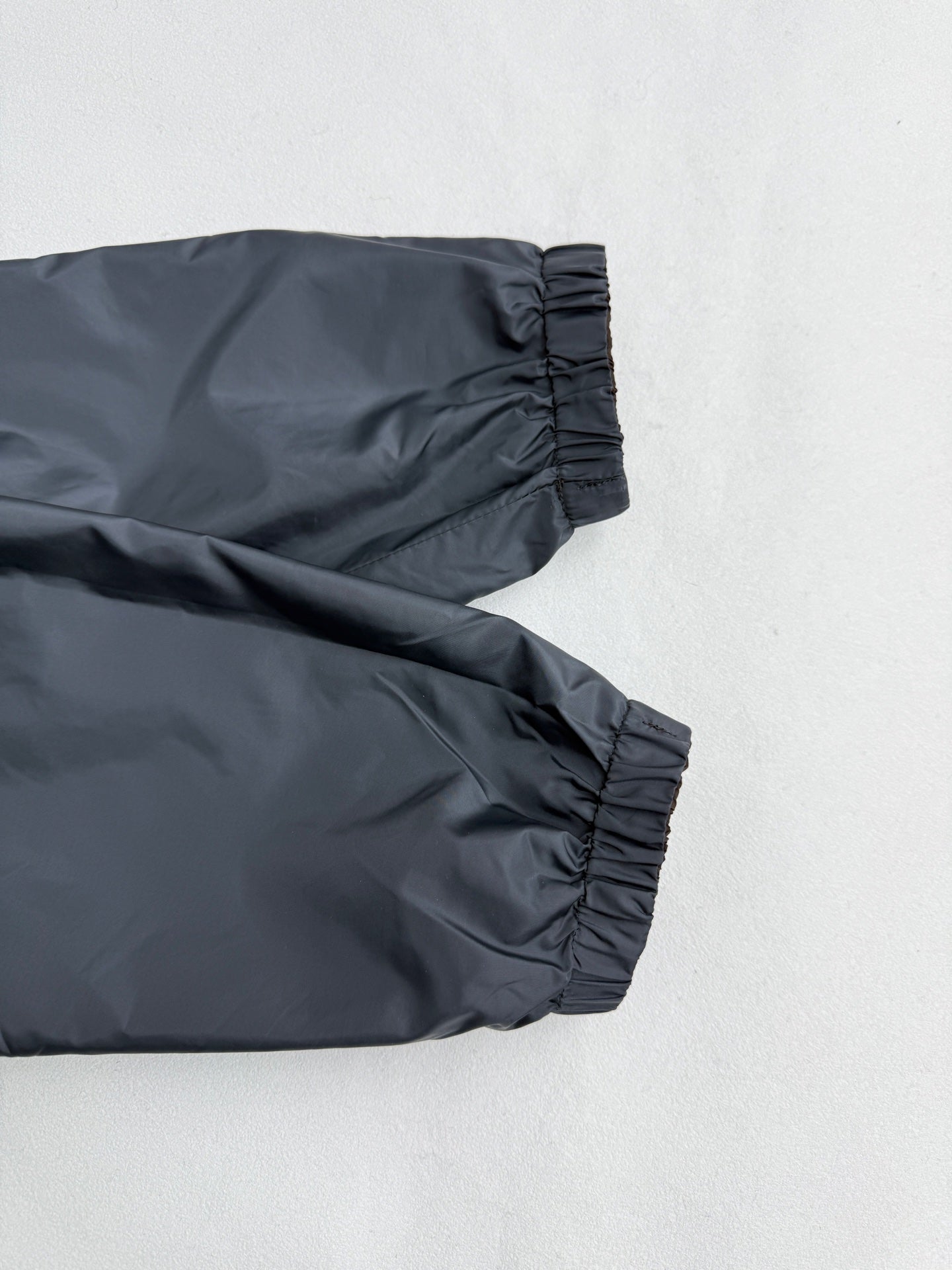 Prada hooded long jacket, blue-gray, ribbed cuff and sleeve seam close-up