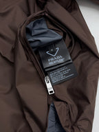 Brown jacket interior with care label and zippered pocket lining