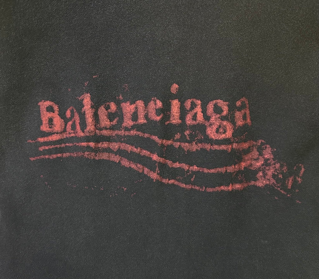 Red Balenciaga logo print on dark hoodie fabric