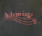 Red Balenciaga logo print on dark hoodie fabric
