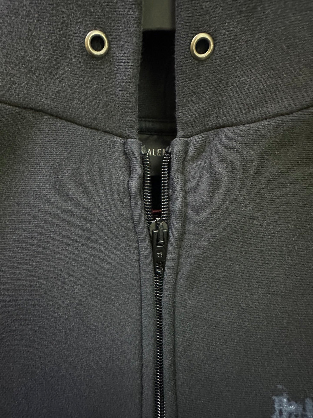 Balenciaga hoodie zipper with cord eyelets near the hood opening