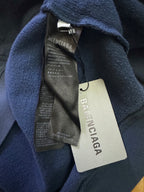Balenciaga hoodie care labels and fabric hang tags on blue hood
