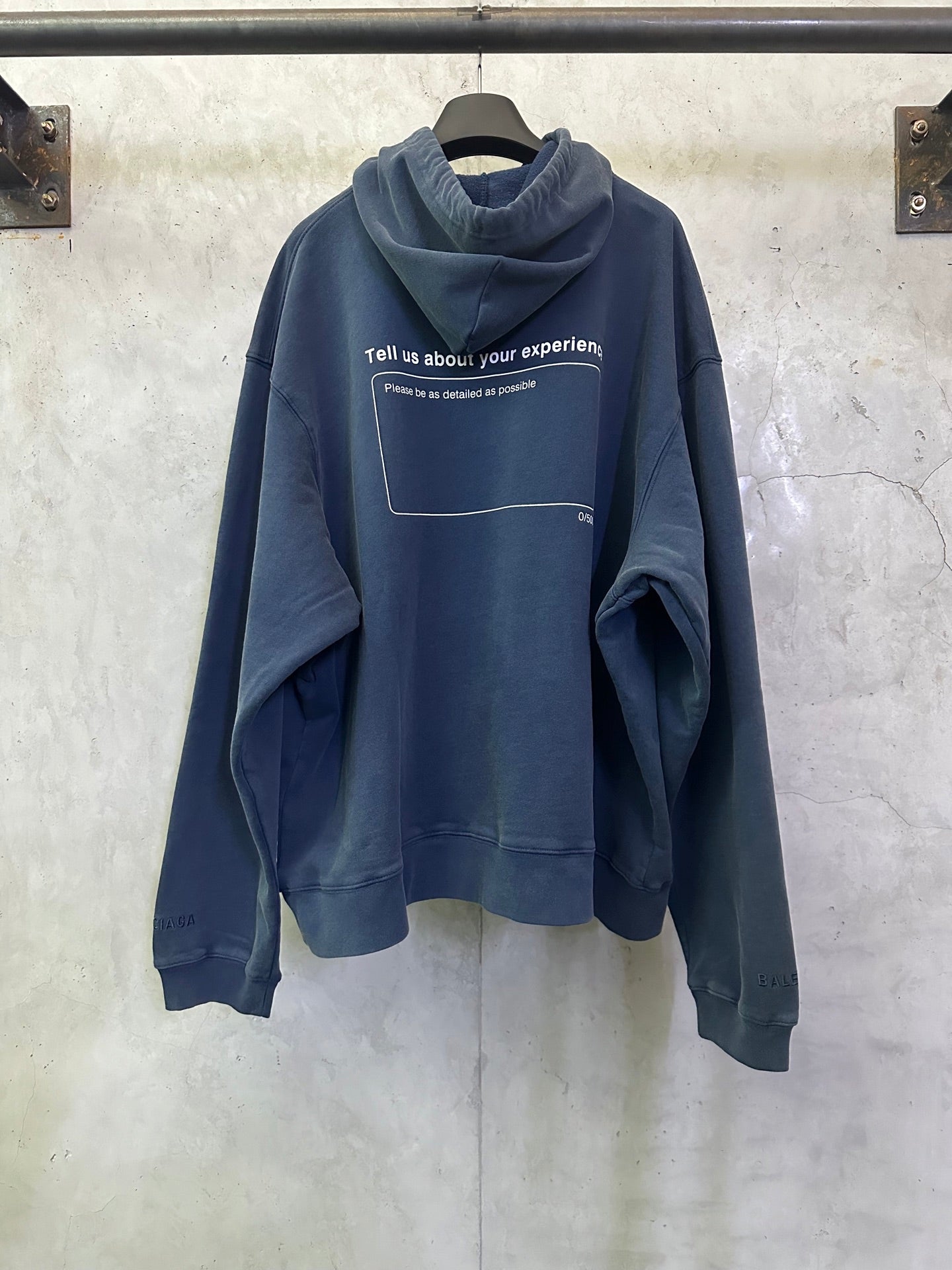 Balenciaga long hoodie, blue, with rear text print in a outlined rectangle