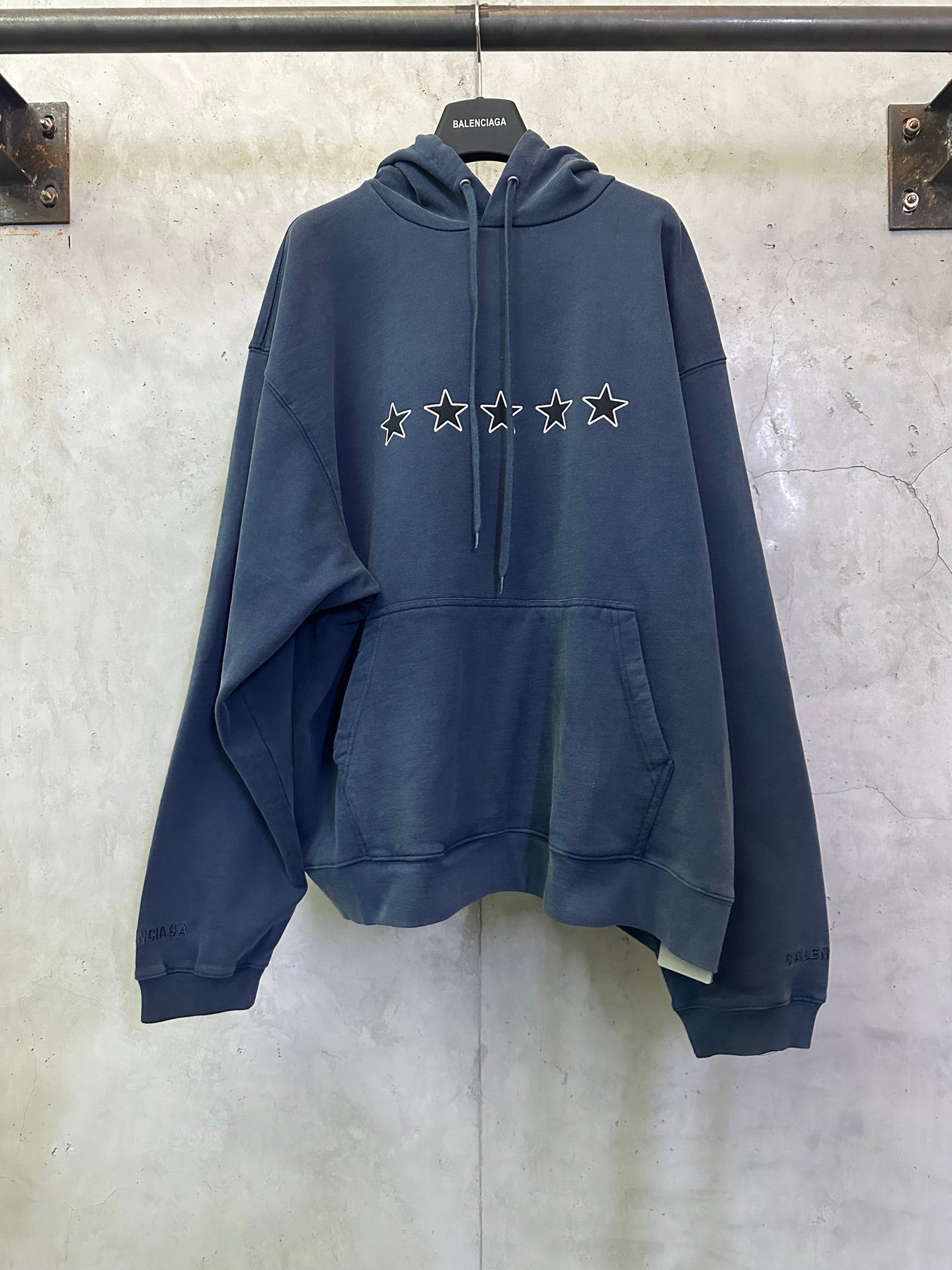 Balenciaga long hoodie in blue with star graphic on the chest and front hood