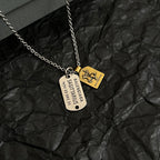 Silver-tone charm necklace with round, gold horse, and document-style pendants