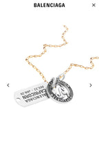 Gold charm necklace with Capricorn tag and circular coin pendant
