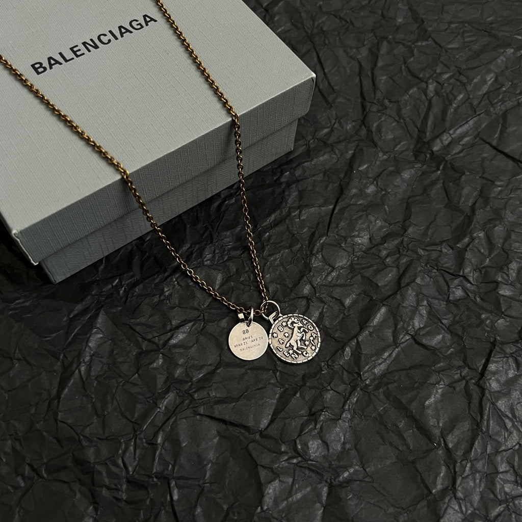 Balenciaga gold-tone charm necklace with circular pendant and round ID medallion