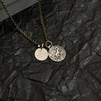 Balenciaga gold-tone charm necklace with circular pendant and round ID charm