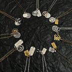 Multi-charm necklace with coin and tag pendants in gold and silver tones
