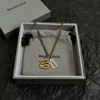 Gold-tone Virgo charm necklace in gray gift box, chain with heart pendant and tag