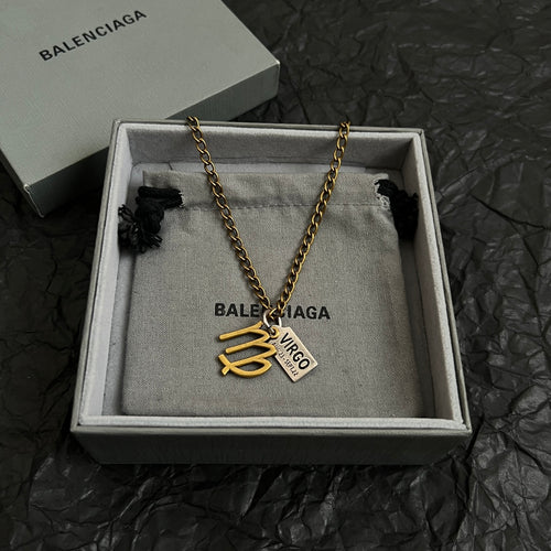 Gold-tone Virgo charm necklace in gray gift box, chain with heart pendant and tag