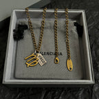 Gold-tone Virgo charm necklace set in gray gift box, multiple chains with date tags
