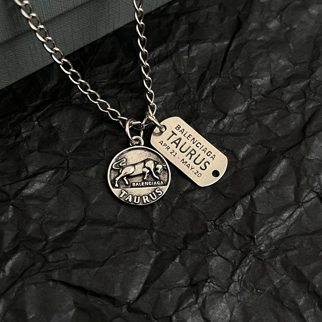 Balenciaga charm pendants necklace, round Taurus charm with engraved tag