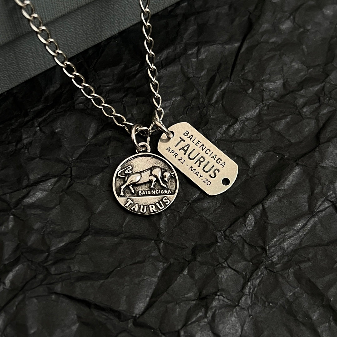 Balenciaga charm pendants necklace, round Taurus charm with engraved tag