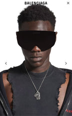 Balenciaga charm necklace on model, silver chain with round Taurus pendant