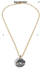 Balenciaga pendant necklace with gold chain and round fish medallion charm