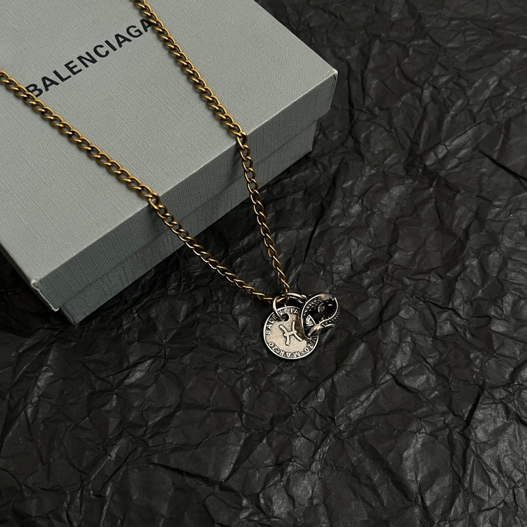 Balenciaga pendant necklace with gold chain and two circular charms