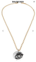Balenciaga pendant necklace with gold chain and silver-toned fish medallion