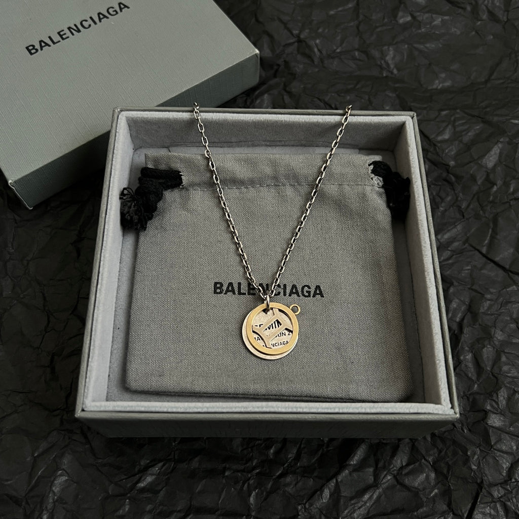 Silver chain necklace with round gold and silver Balenciaga pendant, in gift box